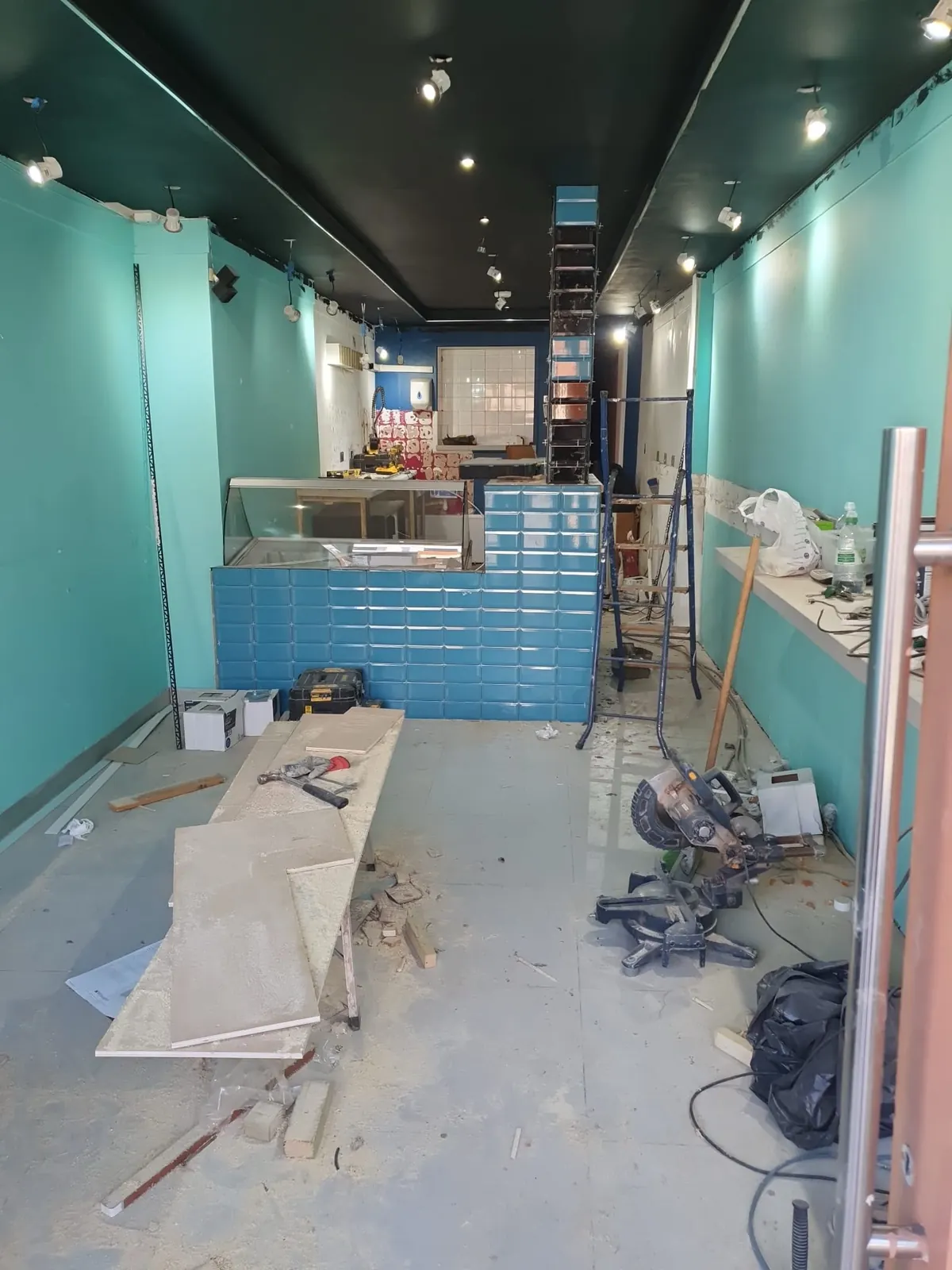 Counter tiling in progress, teal metro tiles, Brentwood