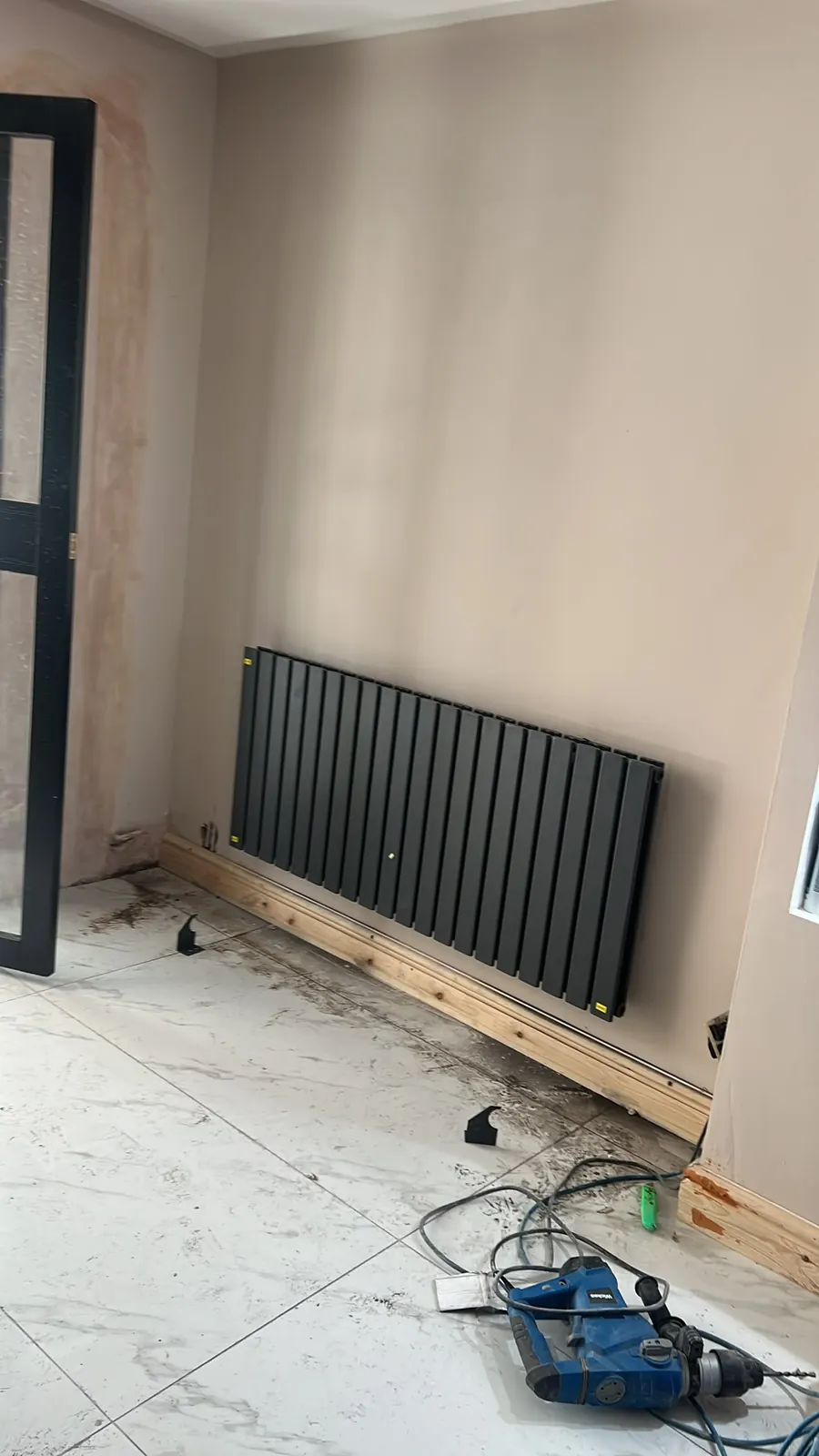 New radiator installed as part of a heating upgrade, Upminster